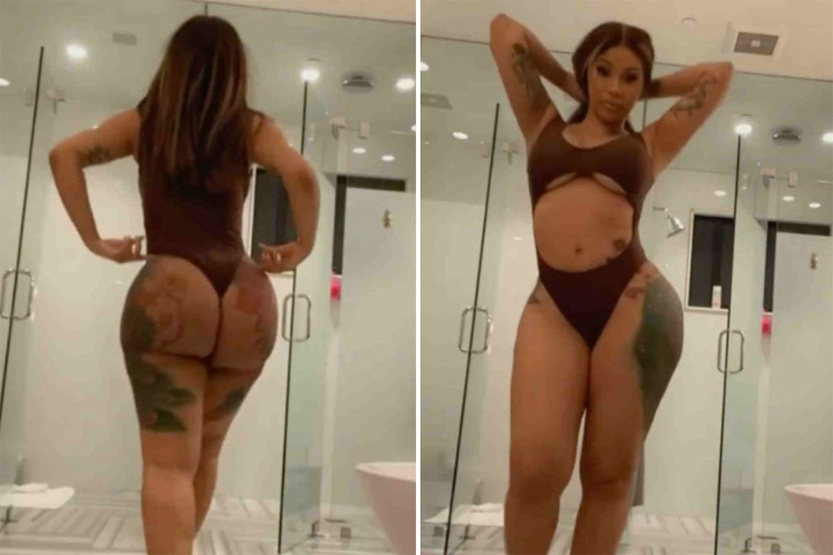 Cardi B shows off her bare butt in a thong swimsuit as she struts around bathroom in heels