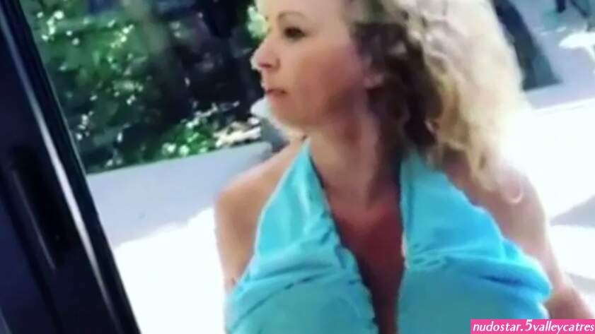 Nadia Sawalha cleans windows with her BOOBS in bizarre video as she tries out sweat-free bra with Kaye Adams