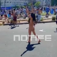 Watch as mystery brunette STRIPS NAKED to celebrate Argentina World Cup triumph in raucous Buenos Aires scenes