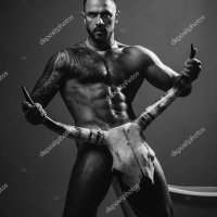 Man with naked torso muscle strong body. Halloween bull horn. Sexy gay with erotic masculine body six pack hold bull horns. Stock Photo 564317344