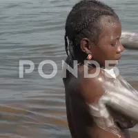 Mother and Child Bathing in Corubal River