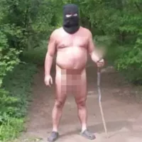 Naked man in balaclava carrying sex toy on a stick terrifies tourists