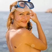 Nude Young Woman on Wild Seashore Stock Image