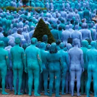 3200 naked volunteers turn the streets of Hull blue in Spencer Tunicks Sea of Hull installation