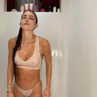 Anllela Sagra slightly nude tits in lace lingerie as she poses wet in the shower
